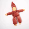 red waldorf soft toy on white background